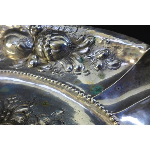 51 - A 19th continental silver fruit dish of oval form, decorated with repousse fruit, stamped '800', 11.... 