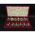 A cased set of American early 20th century silver teaspoons, with bright cut decorated handles, engr... 