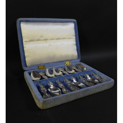 36 - A cased set of eight possibly American silver teaspoons,  with shell mounts, and engraved with 'CPR'... 