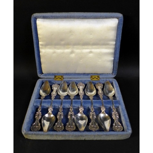 36 - A cased set of eight possibly American silver teaspoons,  with shell mounts, and engraved with 'CPR'... 