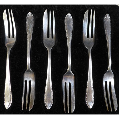 55 - Four cased sets of George V and later silver flatware, comprising two cased sets of six cake forks, ... 