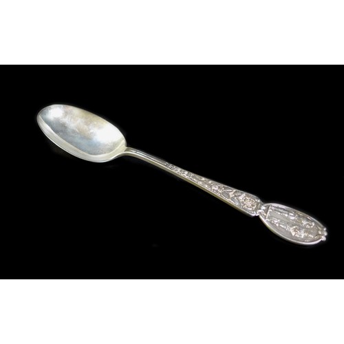 17 - An ornate Edwardian silver table spoon, decorated with Irish clovers, a Scottish thistle and a Tudor... 