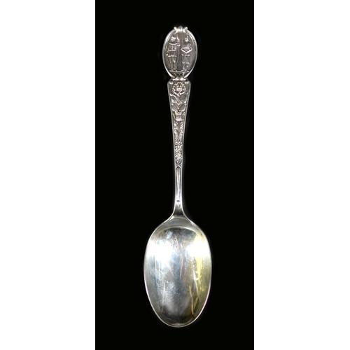 17 - An ornate Edwardian silver table spoon, decorated with Irish clovers, a Scottish thistle and a Tudor... 