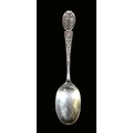 An ornate Edwardian silver table spoon, decorated with Irish clovers, a Scottish thistle and a Tudor... 