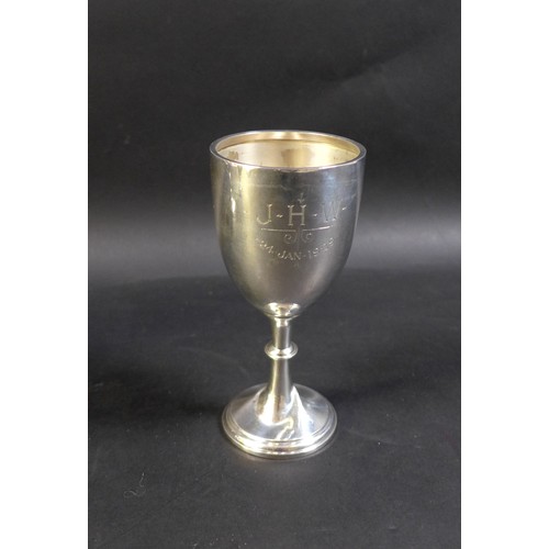 34 - Three silver cups, comprising a George V Christening goblet, inscribed 'J.H.W. 24 Jan 1929', William... 