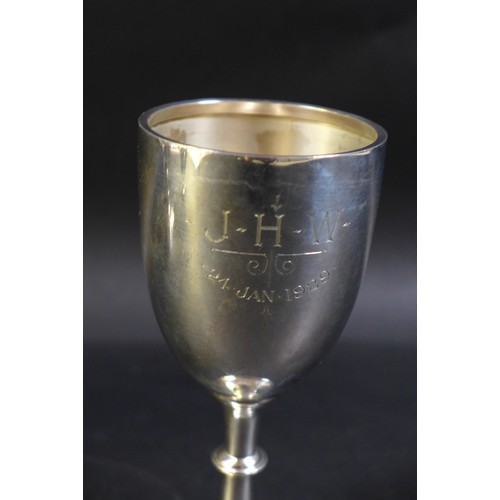34 - Three silver cups, comprising a George V Christening goblet, inscribed 'J.H.W. 24 Jan 1929', William... 