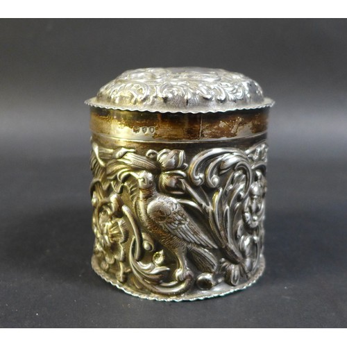 18 - A Victorian silver lidded pot, of cylindrical form, with a engraved monogram 'H E' to its cartouche ... 