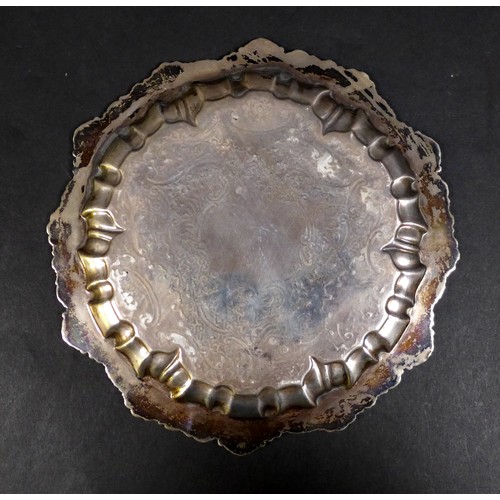 32 - A Victorian silver card tray, with shell and scroll decorative rim, and floral decoration throughout... 