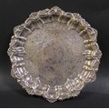 A Victorian silver card tray, with shell and scroll decorative rim, and floral decoration throughout... 