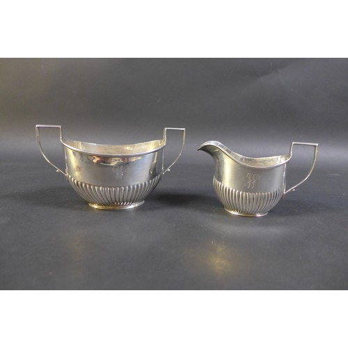 61 - A collection of Victorian and later silver, comprising a two Edwardian tea wares, both with engraved... 