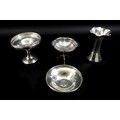 Four pieces of Edwardian and later silver, comprising a George V novelty table from salt, with a hex... 