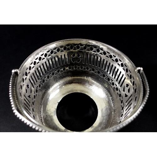 73 - A George III silver pedestal basket, or ice pail, the beaded upper rim above a pierced and chased bo... 