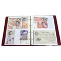 A collection of three albums comprising coins of the Isle of Man, including Christmas 50p coins, Cha... 