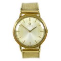 An Omega 9ct gold gentleman's wristwatch, circa 1970s, the circular silvered dial with baton hour ma... 