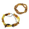 A vintage amber necklace of polished naturalistically shaped beads, ranging from butterscotch throug... 