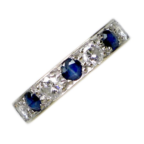 249 - An 18ct white gold, sapphire and diamond seven stone ring, the three round cut sapphires, each 4mm, ... 