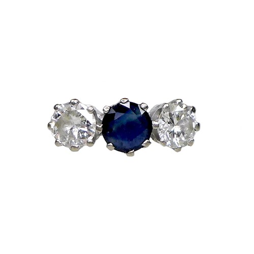 251 - An 18ct white gold, diamond and sapphire three stone ring, the central claw set round cut royal blue... 