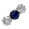 An 18ct white gold, diamond and sapphire three stone ring, the central claw set round cut royal blue... 