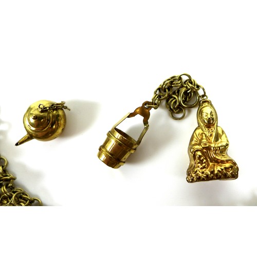 234 - A collection of 14ct gold charms, mostly Asian influenced designs such as a rickshaw, pagoda, buddha... 