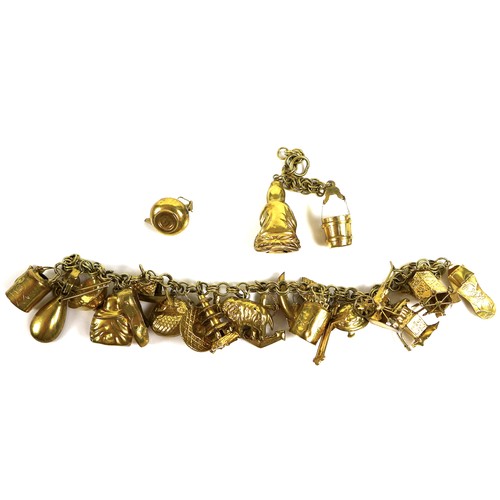 234 - A collection of 14ct gold charms, mostly Asian influenced designs such as a rickshaw, pagoda, buddha... 