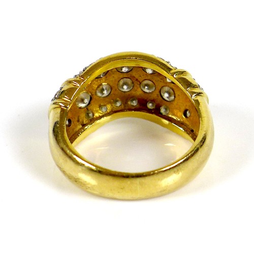 228 - A gold bombe cocktail ring, inset with some diamonds and other white stones, size J, indistinctly ma... 