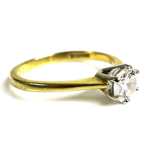 239 - An 18ct gold and diamond solitaire ring, the circular brilliants cut stone in claw mounts, 5.2 by 3.... 