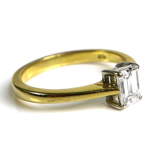 223 - An 18ct gold and diamond solitaire ring, the stone baguette cut in claw mounts, 3.5 by 4.8mm, 0.3ct,... 