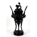 A large Japanese bronze koro, Meiji period, of squat ovoid form with high handles, decorated in high... 