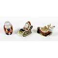 A group of three Royal Crown Derby Christmas paperweights, comprising 'Reindeer', 2001, gold stopper... 