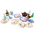 A collection of miniature Chinese pottery and porcelain items, including a Yixing pottery teapot and... 