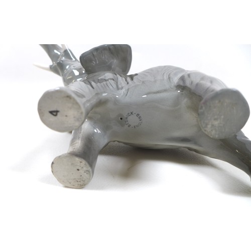 3 - A group of elephants figurines, including a Beswick 'Elephant - Trunk stretching - small', model 974... 