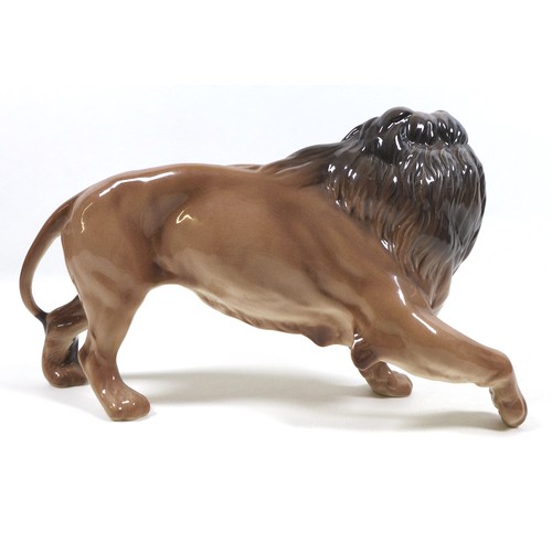 4 - A Beswick Lion - standing, model 2554B, golden brown gloss, 17cm high.