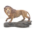 A Beswick 'Lion on Rock', model 2554A, golden brown, satin matt, 21cm high.