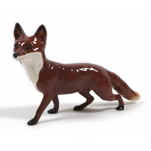 13 - Three Beswick fox figurines, comprising 'Fox- standing', model 1440, red-brown and white - gloss, 6.... 