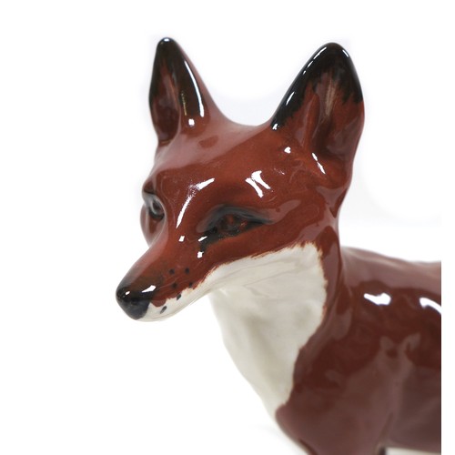 13 - Three Beswick fox figurines, comprising 'Fox- standing', model 1440, red-brown and white - gloss, 6.... 