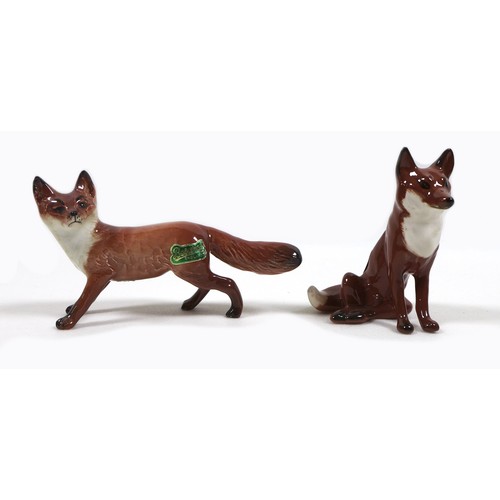 13 - Three Beswick fox figurines, comprising 'Fox- standing', model 1440, red-brown and white - gloss, 6.... 