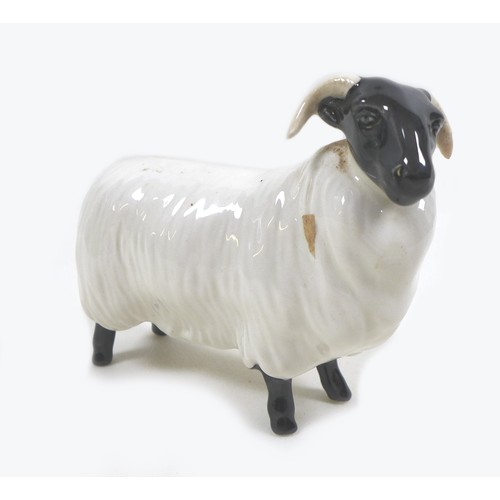 17 - A Beswick Black Faced Sheep, model 1765, black and white - gloss, 8cm high with box.