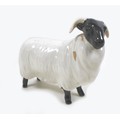 A Beswick Black Faced Sheep, model 1765, black and white - gloss, 8cm high with box.