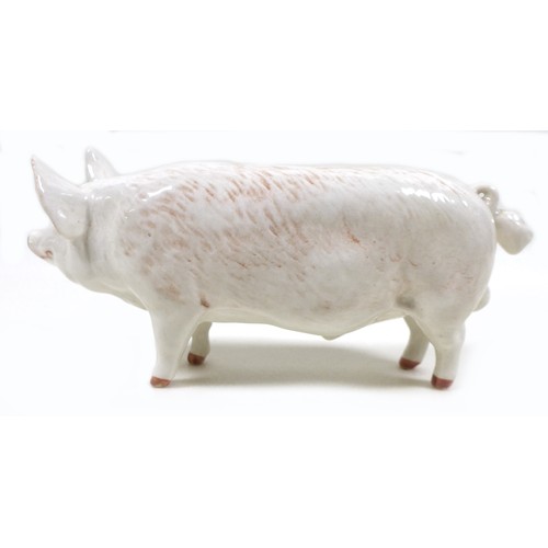 20 - A group of two pig figurines, comprising a Royal Doulton 'Vietnamese Pot-Bellied Piglet', model G213... 