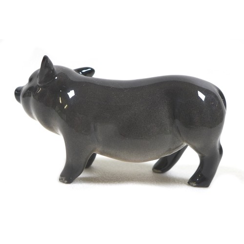 20 - A group of two pig figurines, comprising a Royal Doulton 'Vietnamese Pot-Bellied Piglet', model G213... 