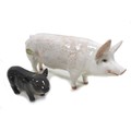 A group of two pig figurines, comprising a Royal Doulton 'Vietnamese Pot-Bellied Piglet', model G213... 