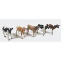 A group of five Beswick calves, including two Friesian calves, model 1249C, black and white - gloss,... 