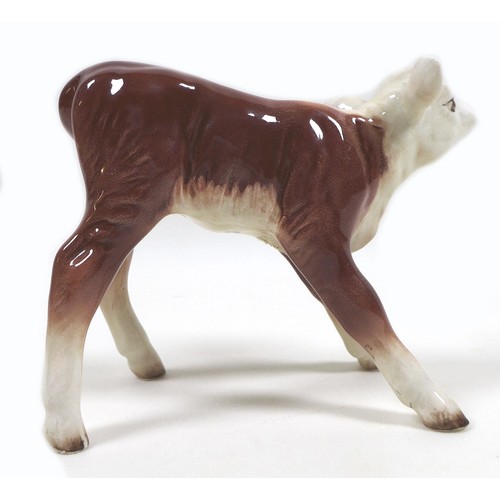 27 - Two Beswick calves, comprising a 'Hereford Calf', model 901B, Second Version - Mouth closed, brown a... 