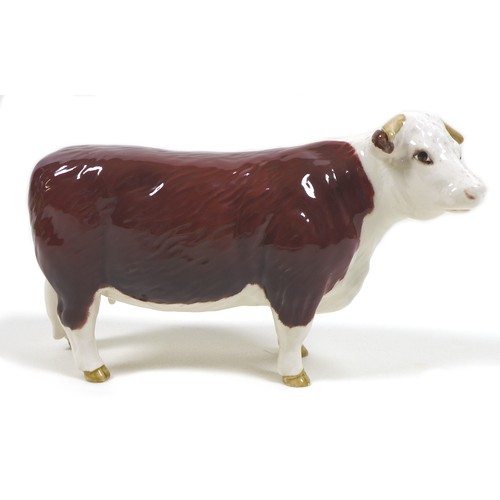 32 - A group of three Beswick cows, comprising a 'Hereford Cow 