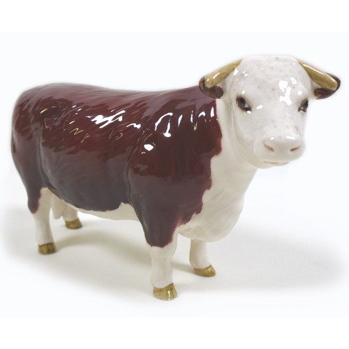 32 - A group of three Beswick cows, comprising a 'Hereford Cow 