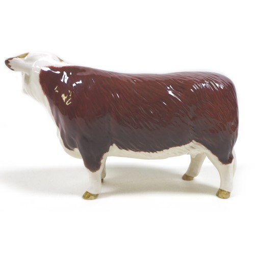 32 - A group of three Beswick cows, comprising a 'Hereford Cow 