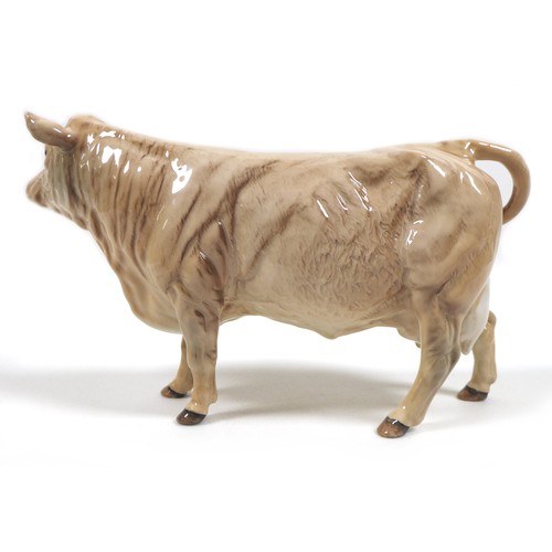 32 - A group of three Beswick cows, comprising a 'Hereford Cow 