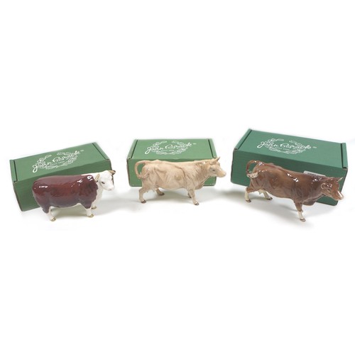 32 - A group of three Beswick cows, comprising a 'Hereford Cow 