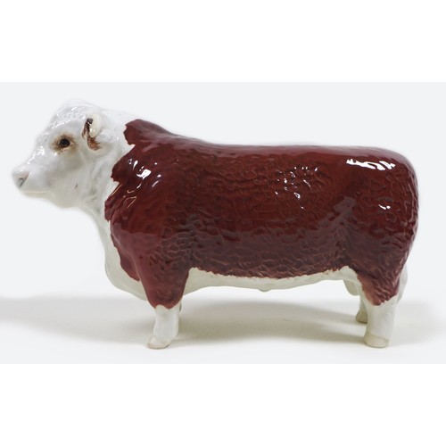 33 - Two Beswick cows, comprising a 'Hereford Cow 