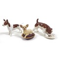 A group of three Beswick dogs, comprising 'Chihuahua - Lying on cushion', model 2454, cream dog, mar... 